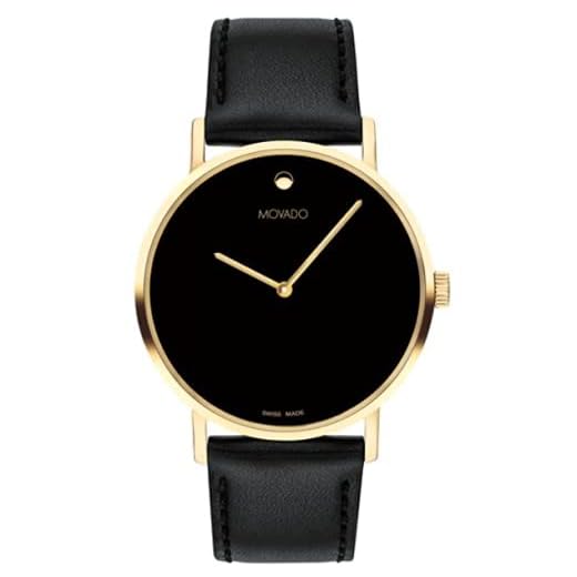 Movado Reloj de oro amarillo de la firma de los hombres con esfera cóncava del museo del punto, correa dorada/negra (modelo 0607591)