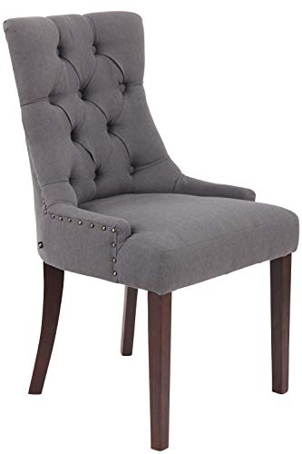 DESIGN CHESTER - sedia da pranzo in perfetto stile Chesterfield, seduta comodamente imbottita e trapunta, con eleganti bottoni rivestiti in tessuto. La poltroncina soggiorno si dota di alto schienale che - più ampio alle estremità della seduta - caratterizza il disegno ad ispirazione capitonné. Le borchiette fermano elegantemente la fodera alle estremità della poltrona salotto