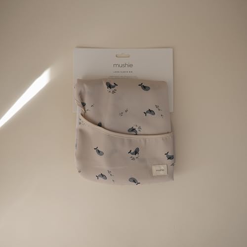 mushie Long Sleeve Baby Bib | Water Resistant Adjustable Fit for Ages 6-24 Months