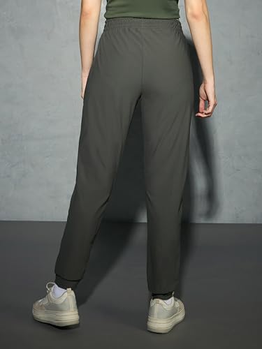 Image of TECHNOSPORT Womens Mid Rise Polyester Regular Fit Solid Jogger for Running, Workout & Sports