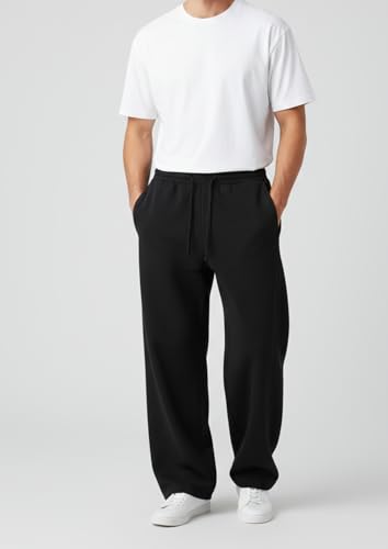 Image of Aesthetic Gothic Wide Leg Pants for Men | Tribal Print Baggy Streetwear | Oversized Track Pants with Elastic Waist | Black and White Relaxed Fit Bottoms