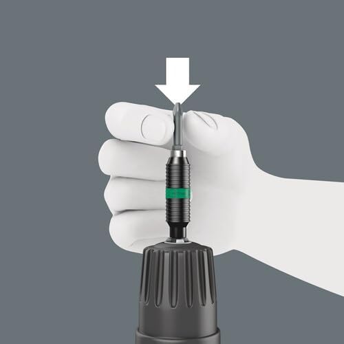 Hand inserting a screwdriver bit into the Wera bit holder