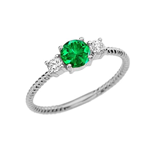 Delicado anillo de mujer en Oro blanco de 9 quilates con esmeralda y topacio blanco