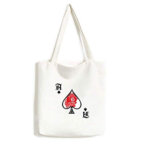 Sac à main avec lanterne rouge en broderie artisanale et motif pique chic
