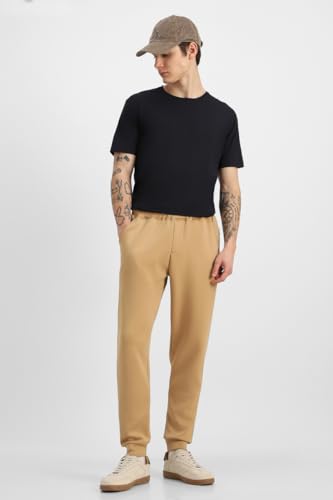 Image of SNITCH Men Track Pants | Relaxed Fit with Contrast Side Stripes & Zippered Pockets | Polyester Blend Fabric for Athletic & Street Wear | Stretchable & Comfortable Design