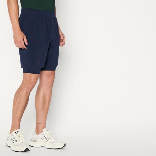 Image of Amazon Essentials Men's Athletic Running Training Shorts, Performance Stretch Woven Workout Shorts, 7 inch