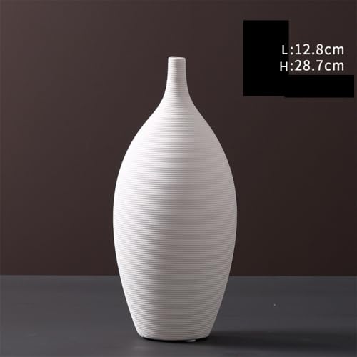 Arrangement de vase en céramique blanche et décoration florale de table
