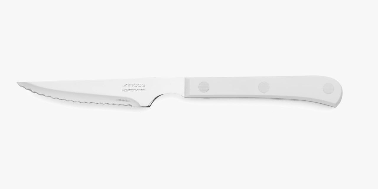 Arcos Serie Cuchillos de Mesa Caja 12 uds Cuchillo Chuletero, Hoja Serrada de Acero Inoxidable NITRUM de 115 mm, Mango Polioximetileno Color blanco (12 UDS)