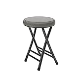 teak hocker 50er Das Sitzpolster des Sitzhockers besteht aus grauem Kunstleder während das Gestell aus Metall ist.