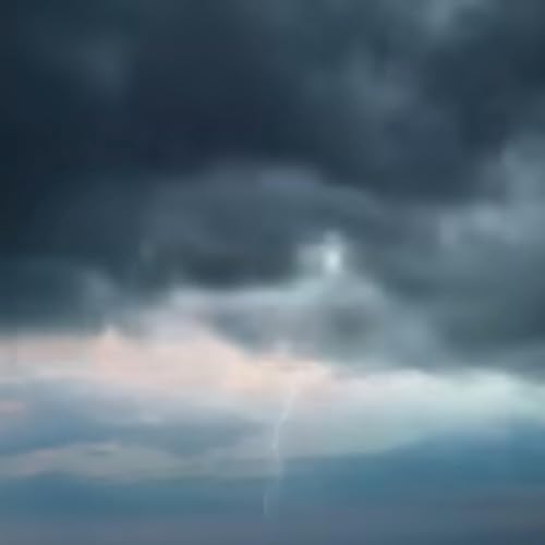 Heavy rainfall with the sound of thunder and lightning.