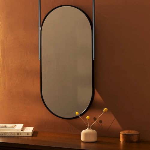 Miroir suspendu ovale pour gagner de l'espace sur les murs