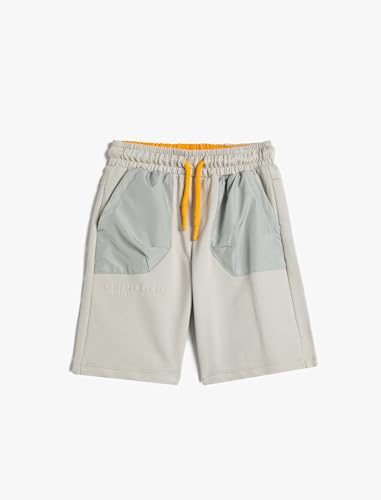 Pantalones cortos niños en algodón gris Koton con bolsillos y cordón ajustable