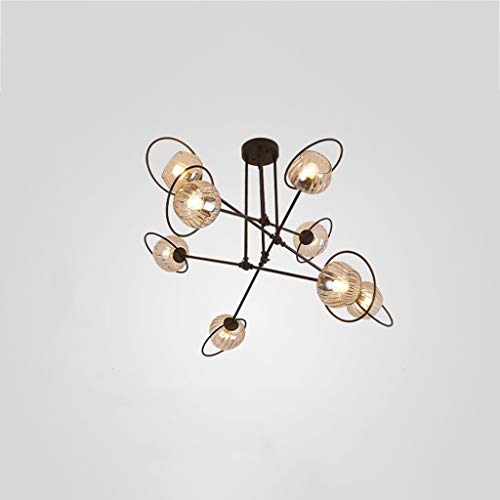 Lustre 8 têtes laiton brossé : la solution pour un salon sombre