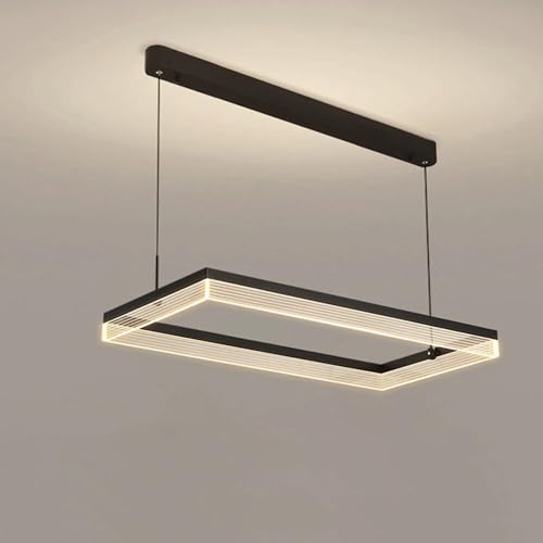 Suspension noire au-dessus de la table à manger pour îlot de cuisine moderne