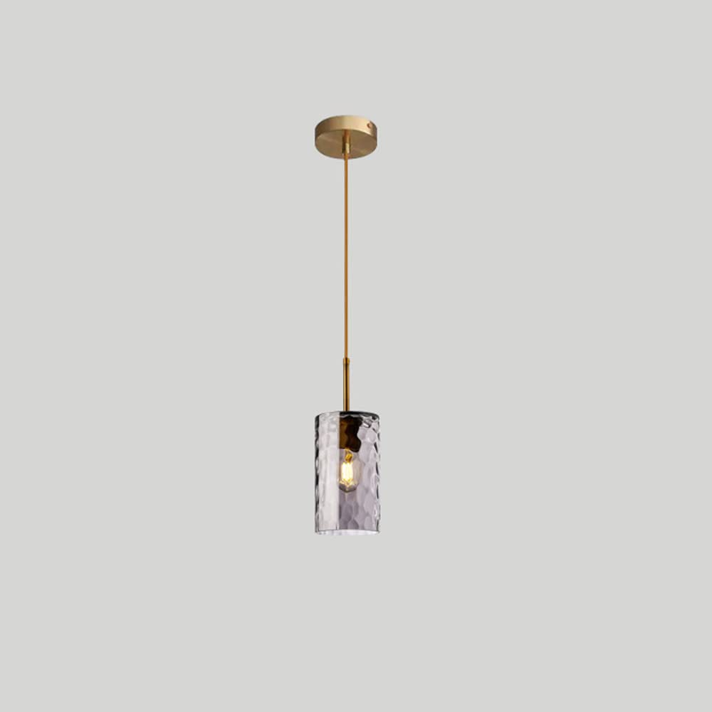 Lámpara colgante ajustable sobre la mesa de comedor con cristal gris