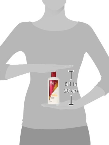 Vidal Sassoon conditioner bottle held by a person, showing product dimensions