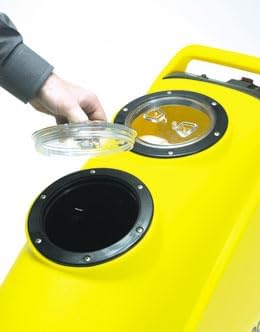 A hand lifting a clear lid from one of the two circular openings on top of the yellow carpet extractor, revealing the tank opening.