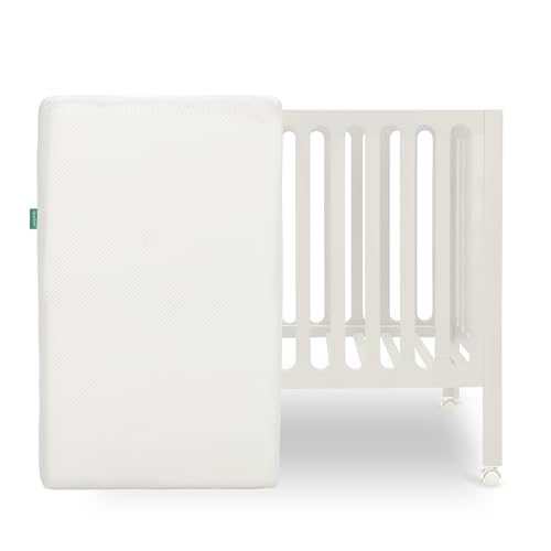 Image of Newton Baby Galileo Mini Crib Solid Beech Wood with Wheels in Warm White, Mini Crib Mattress Included, Adjustable Mattress Height, Ultra-Safe Non-Toxic Finish