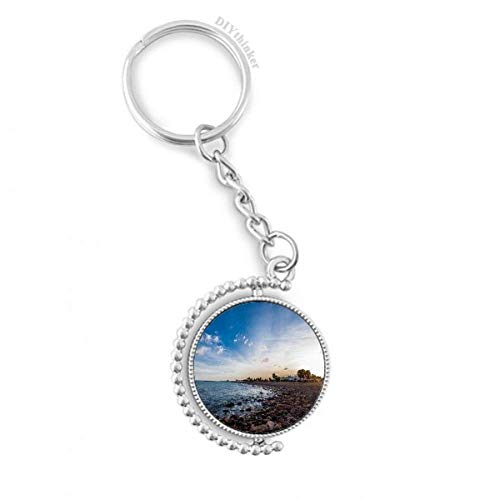 Llavero giratorio con imagen de playa y mar para organizar tus llaves con estilo caribeño