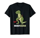 Divertido regalo de dinosaurio de hockey que muestra un dinosaurio verde jugando al hockey. Dinosaurio de hockey sobre hielo con palo de hockey y disco de hockey sobre hielo. Regalo perfecto de hockey para niños y niñas que aman los dinosaurios y el hockey.