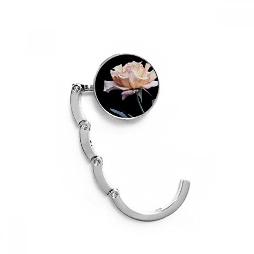 Cintre porte sac pliable Rose Blanc pour protéger vos sacs des sols sales au restaurant