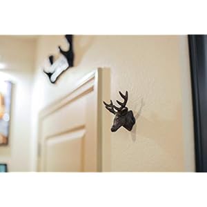 Setof3rusticbrowncastirondeerheadwallhooksforlodgeandcabindecor425incheslongantiquebrownhooksforcoatsrobestowelsandkeys Urban Country Home Decor Set of 3 rustic brown cast iron deer head wall hooks for lodge and cabin decor 425 inches long antique brown hooks for coats robes towels and keys urban country home decor