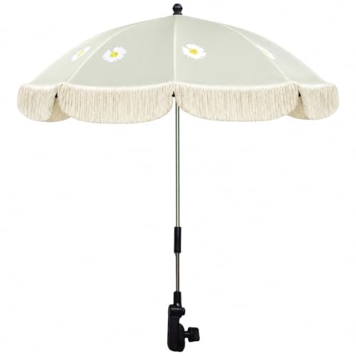 Sombrilla de playa para bebé en días junto al mar con ligeras borlas decorativas