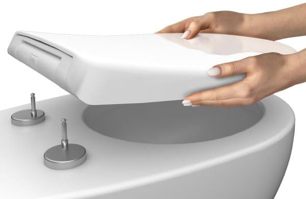 Hands carefully placing the Bemis Coralink toilet seat onto the two mounting posts on the toilet bowl.