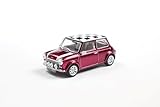 carro mini cooper rosa Clásico coche pequeño icónico: el Mini Cooper Sport de 1997 es sinónimo de diseño compacto, construcción ágil e historia automotriz británica en forma icónica