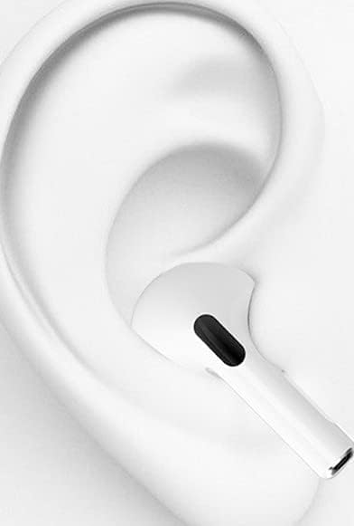 Close-up of a white in-ear earbud correctly placed in an ear