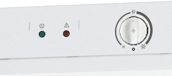 Close-up of the Indesit UI4 2 W freezer control panel with temperature dial and indicator lights