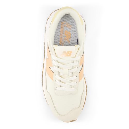 New Balance Women's 237 V1 Sneaker, Angora/Hazy Peach/Washed Amber, 11