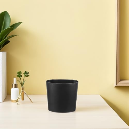 Cesta de almacenamiento colgante negra que soluciona el desorden de botes en el baño 7