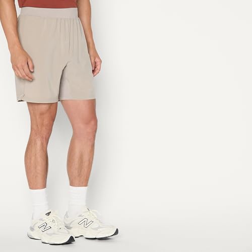 Image of Amazon Essentials Men's Athletic Running Training Shorts, Performance Stretch Woven Workout Shorts, 7 inch