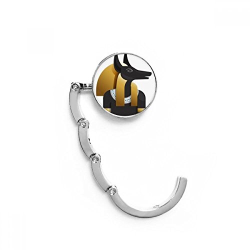 Colgador plegable para evitar apoyar el bolso en el suelo con modelo de Anubis