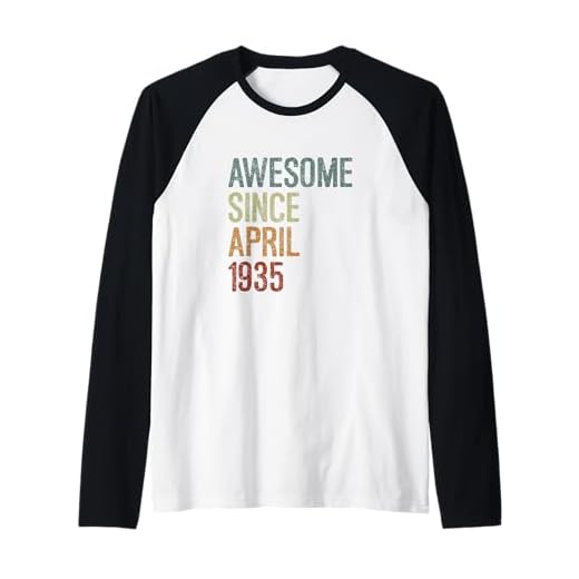 Impresionante desde abril de 1935, regalo de cumpleaños divertido retro Camiseta Manga Raglan