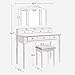 VASAGLE Vanity Makeup Set with 7 Drawers, 2 Brush Slots and 4 Open Compartments, Dressing Table with Tri-Fold Necklace Hooked Mirror, Solid Wood Legs, Cushioned Stool, Cloud White URDT06M