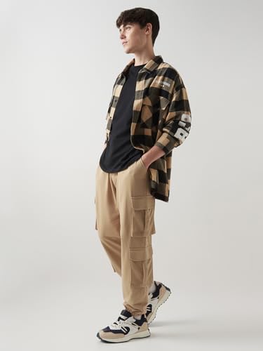 Image of Bewakoof Men's Cotton Super Loose Fit Joggers|Bewakoof Air 1.0 | Track pants for man | Lower for man | Trouser for men | Baggy trackpants for men | Multipurpose | Mens Lower Activewear | Utility Pockets | Lightweight & Flexible Elastic Waist | Casual Joggers | Loose Fit