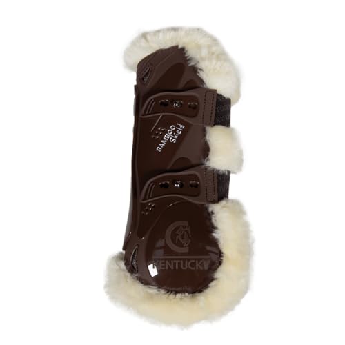 Guêtres de jumping marron pour les séances d'obstacle sur un terrain en herbe