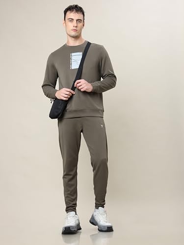 Image of TECHNOSPORT Men's Slim Fit Track Pants with Zip Pockets, ELASTO Plus Quick Dry Stretchable Lightweight Lower for Gym Running Yoga and Sports