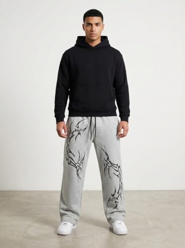 Image of Aesthetic Gothic Wide Leg Pants for Men | Tribal Print Baggy Streetwear | Oversized Track Pants with Elastic Waist | Black and White Relaxed Fit Bottoms