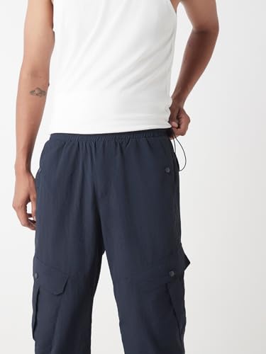 Image of Bewakoof Men's Solid Super Loose Fit Nylon Joggers