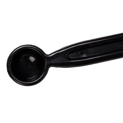 Close-up of the measuring spoon integrated into the Budan Cleaning Brush handle