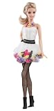 * The dress celebrates that fashion heritage with 50 shoes sewn into the gown