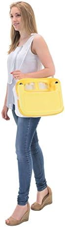 A person carrying the folded Badabulle B009009 Booster Seat by its integrated handle.