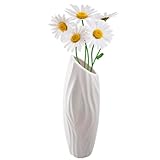 Élégance simple : les vases de style géométrique ne sont pas seulement des vases ordinaires, mais aussi de beaux artefacts aux lignes élégantes qui donnent à votre intérieur une esthétique unique.