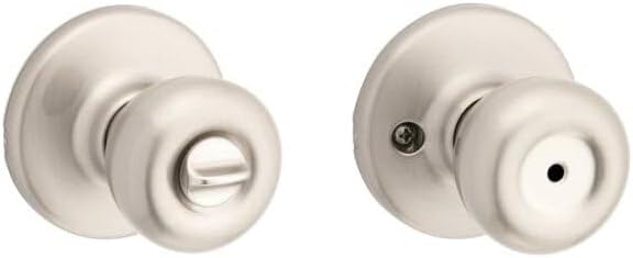 Kwikset Tylo Privacy Door Knob installed on a wooden interior door