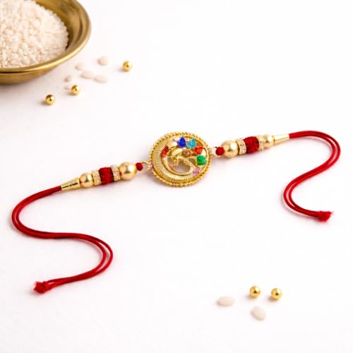 Image of JAIPUR ACE Designer Gold Plated Om Rakhi with Multicolor Stones - Premium Raksha Bandhan Thread for Brother, Elegant Ganesha Rakhi with Red String, Beads & Festive Traditional Finish (Golden Om rakhi)