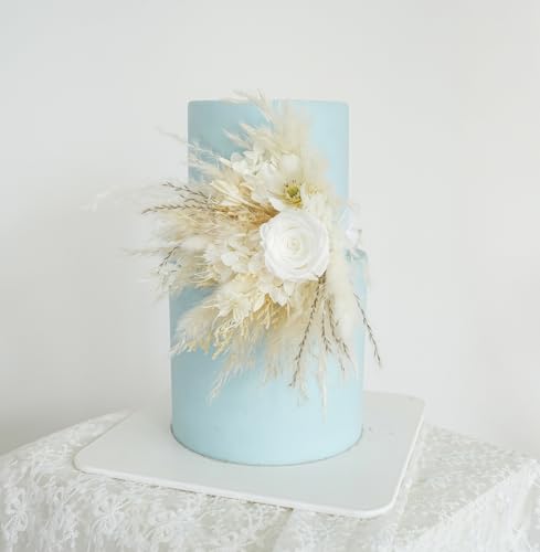 Decoración floral seca para pastel de boda blanco