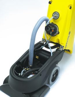 Ички view of the Tornado Marathon 1200 carpet extractor with the top cover removed, showing hoses, wiring, and mechanical components.